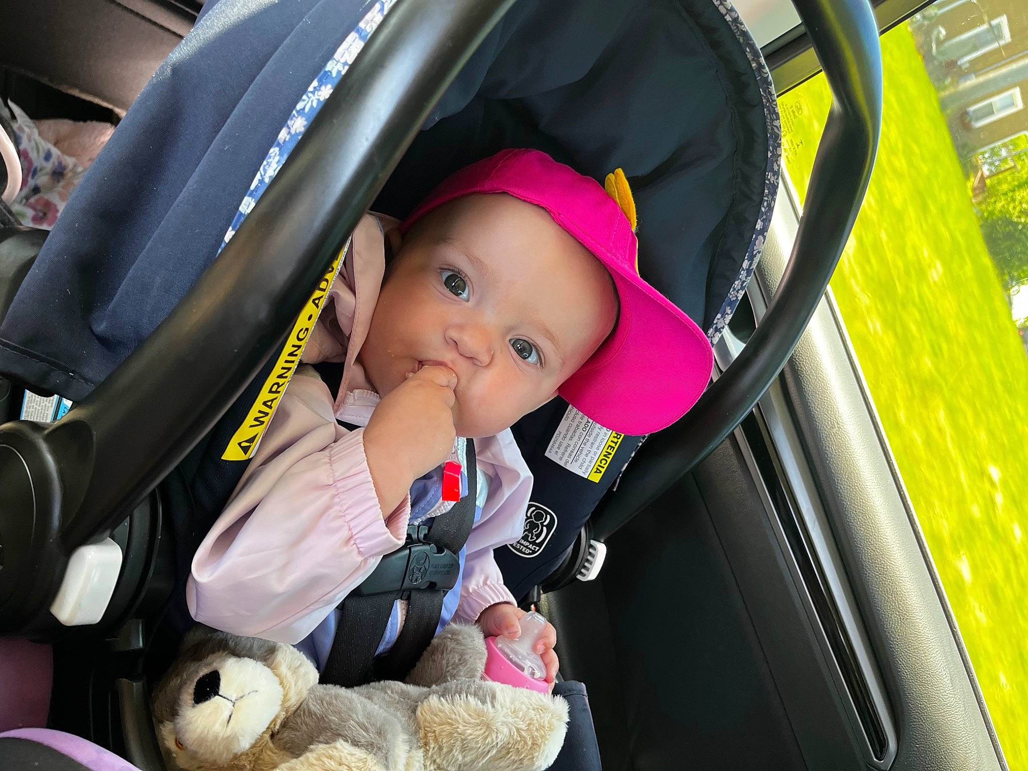 Emilia is registered to the contest to win money with this photo: auto_part, automotive_design, baby, baby_carriage, baby_in_car_seat, baby_products, baby_safety, baby_toddler_clothing, bag, car_seat, child, comfort, fashion_accessory, fun, hat, person, product, steering_wheel, toddler, travel