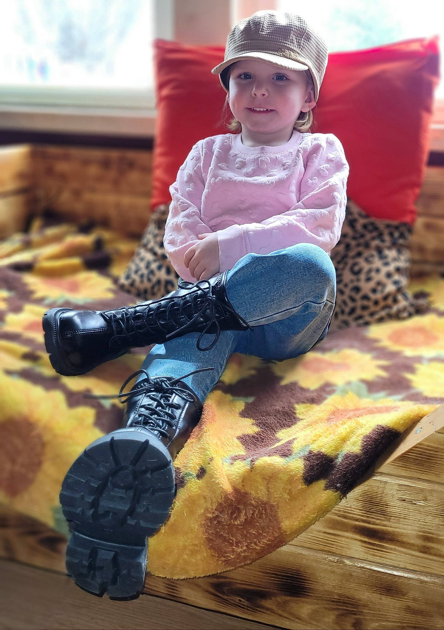 Sage is registered to the contest to win money with this photo: child, flooring, fun, happy, headgear, headwear, helmet, human_leg, joy, knee, leg, leisure, person, personal_protective_equipment, rolling, shoe, sneakers, sports_equipment, sports_gear, thigh