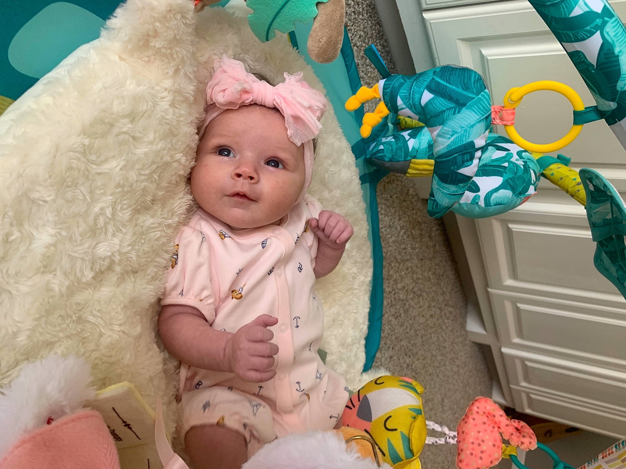 Laura is registered to the contest to win money with this photo: baby, baby_products, baby_toddler_clothing, baby_toys, cheek, child, doll, event, fawn, fun, green, headwear, iris, person, pink, plush, room, stuffed_toy, textile, toddler
