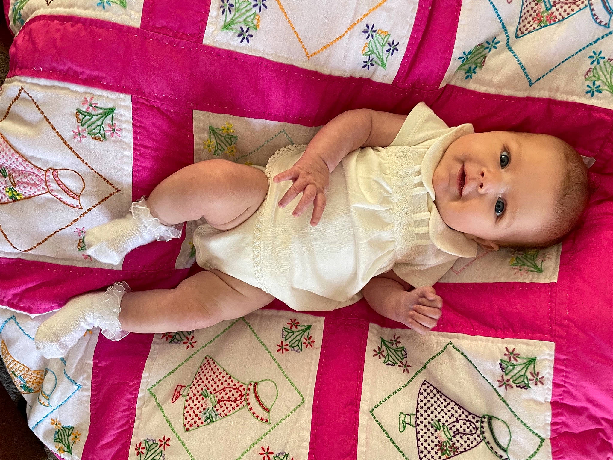 Laura joined the competition — help win amazing prizes! arm, baby, baby_products, baby_toddler_clothing, child, dress, face, hand, happy, hat, human_body, linens, magenta, pattern, person, pink, product, skin, smile, textile