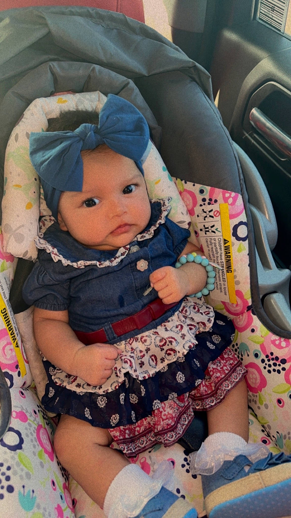 Amy is registered to the contest to win money with this photo: baby, baby_carriage, baby_toddler_clothing, car, car_seat, car_seat_cover, child, comfort, doll, eye, head_restraint, headwear, human_body, motor_vehicle, person, personal_luxury_car, pink, skin, steering_wheel, toddler