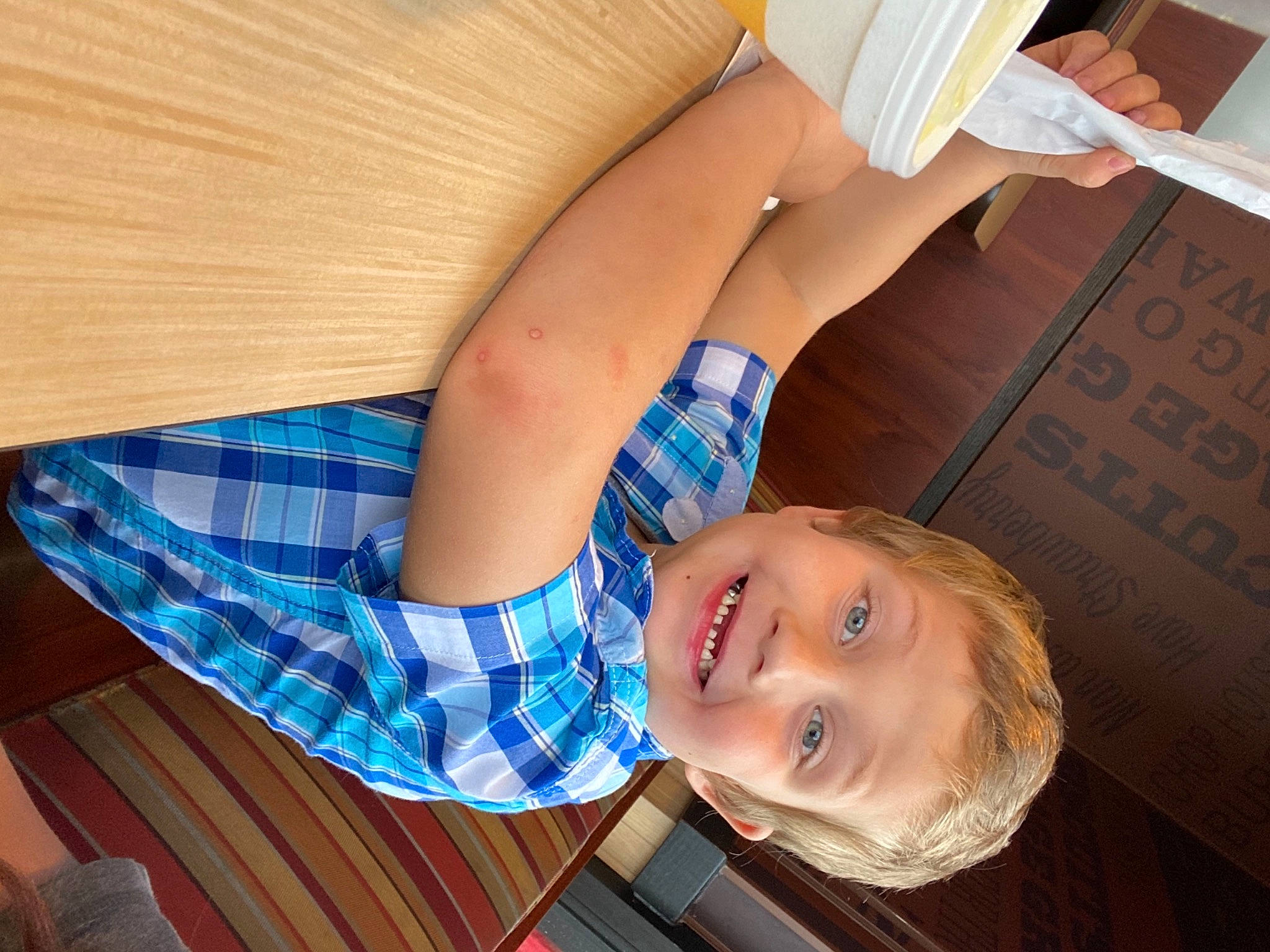 Kohen joined the competition — help win amazing prizes! comfort, couch, elbow, electric_blue, flooring, gesture, happy, human_body, human_leg, joint, joy, knee, pattern, person, plaid, shoulder, smile, tartan, thigh, trunk