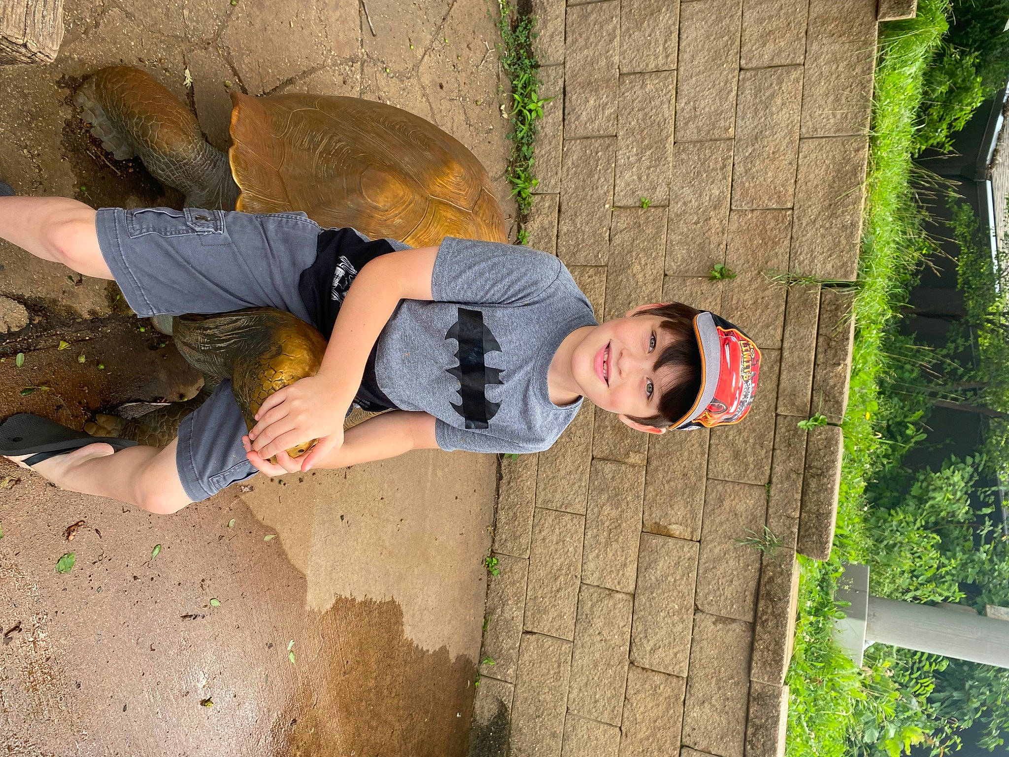 Garrett joined the competition — help win amazing prizes! adventure, bermuda_shorts, child, fun, grass, hat, joy, leisure, people_in_nature, person, plant, recreation, shorts, smile, soil, t_shirt, thigh, tree, trunk, walking_shoe