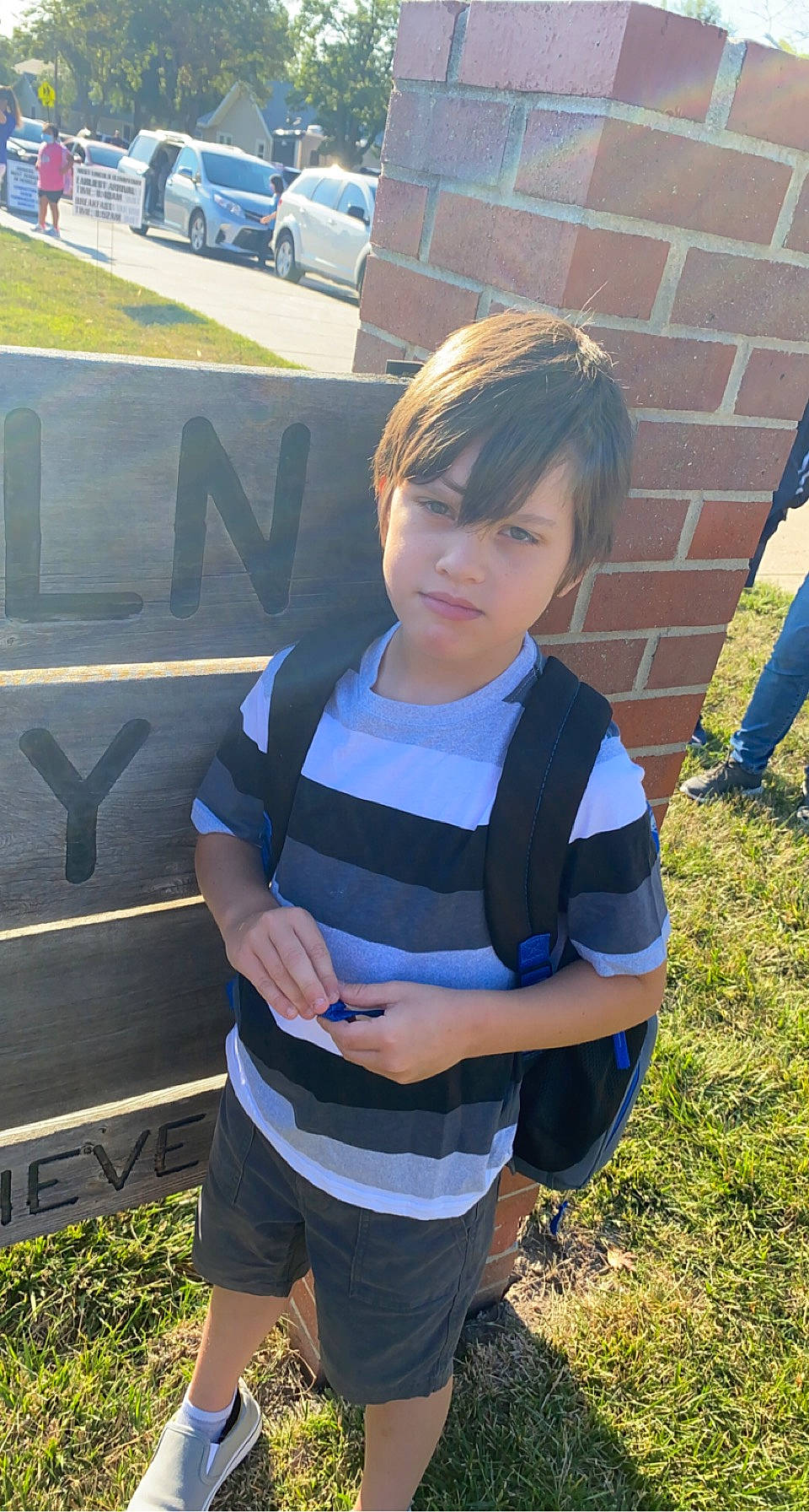 Garrett joined the competition — help win amazing prizes! automotive_exterior, automotive_wheel_system, automotive_window_part, bumper, child, cool, electric_blue, eyewear, family_car, fun, grass, lawn, leisure, motor_vehicle, person, plant, recreation, shorts, t_shirt, tree