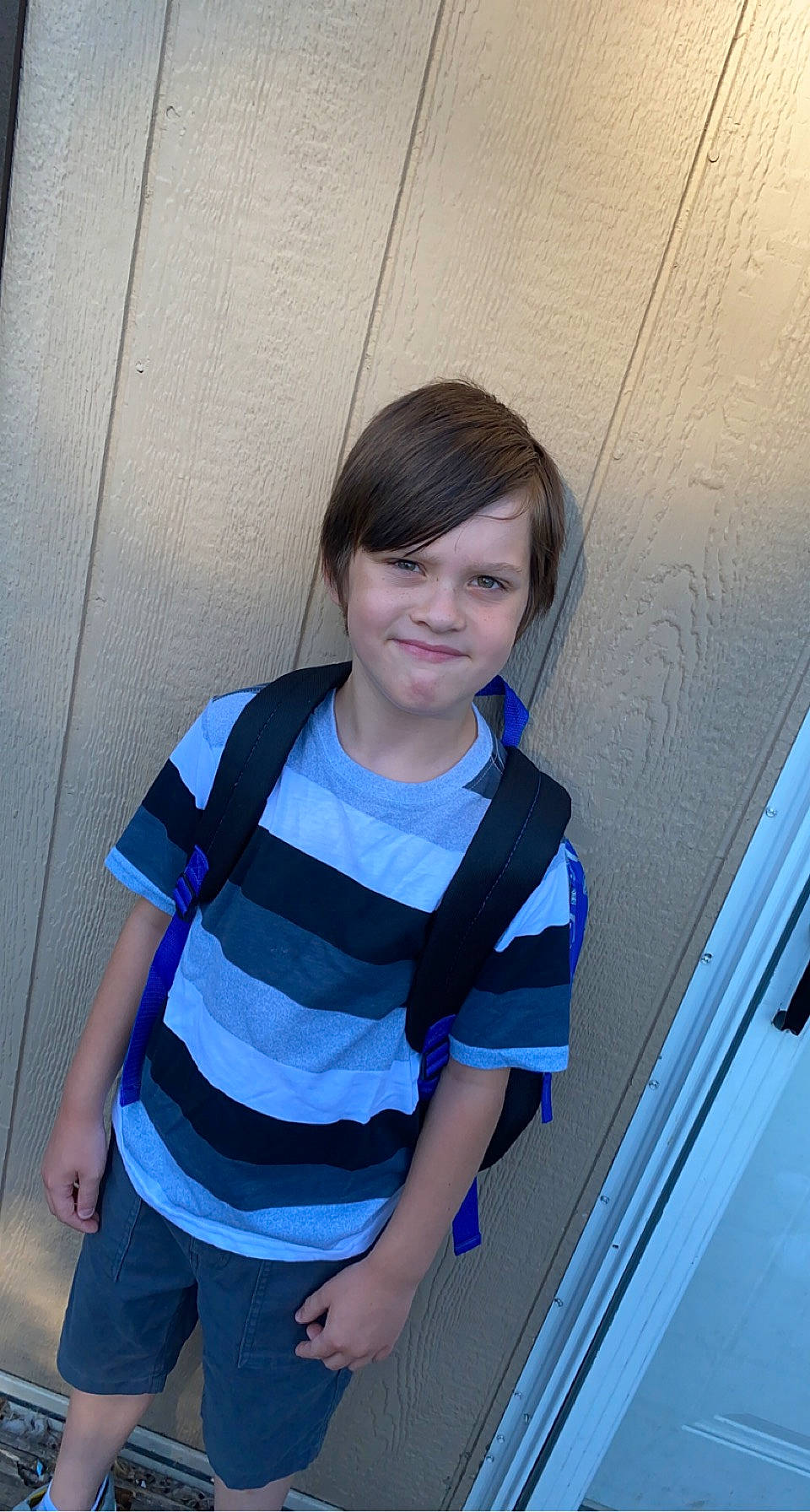 Garrett is registered to the contest to win money with this photo: arm, child, chin, elbow, electric_blue, facial_expression, flash_photography, fun, happy, human_leg, joy, leisure, neck, person, shoulder, sitting, sleeve, smile, t_shirt, toddler