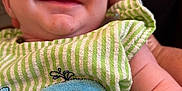 Cole is registered to the contest to win money with this photo: baby, blue, child, closeup, clothing, cute, fabric, green, hand, happy, infant, joy, newborn, person, portrait, skin, smiling, soft, striped, whale