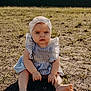 Emberlyn is registered to the contest to win money with this photo: baby, child, outdoor, sunlight, grass, dirt, headband, blue_dress, barefoot, sitting, serious_expression, young_child, nature, summer, grass_patch, infant, portrait, person, cute, fashion