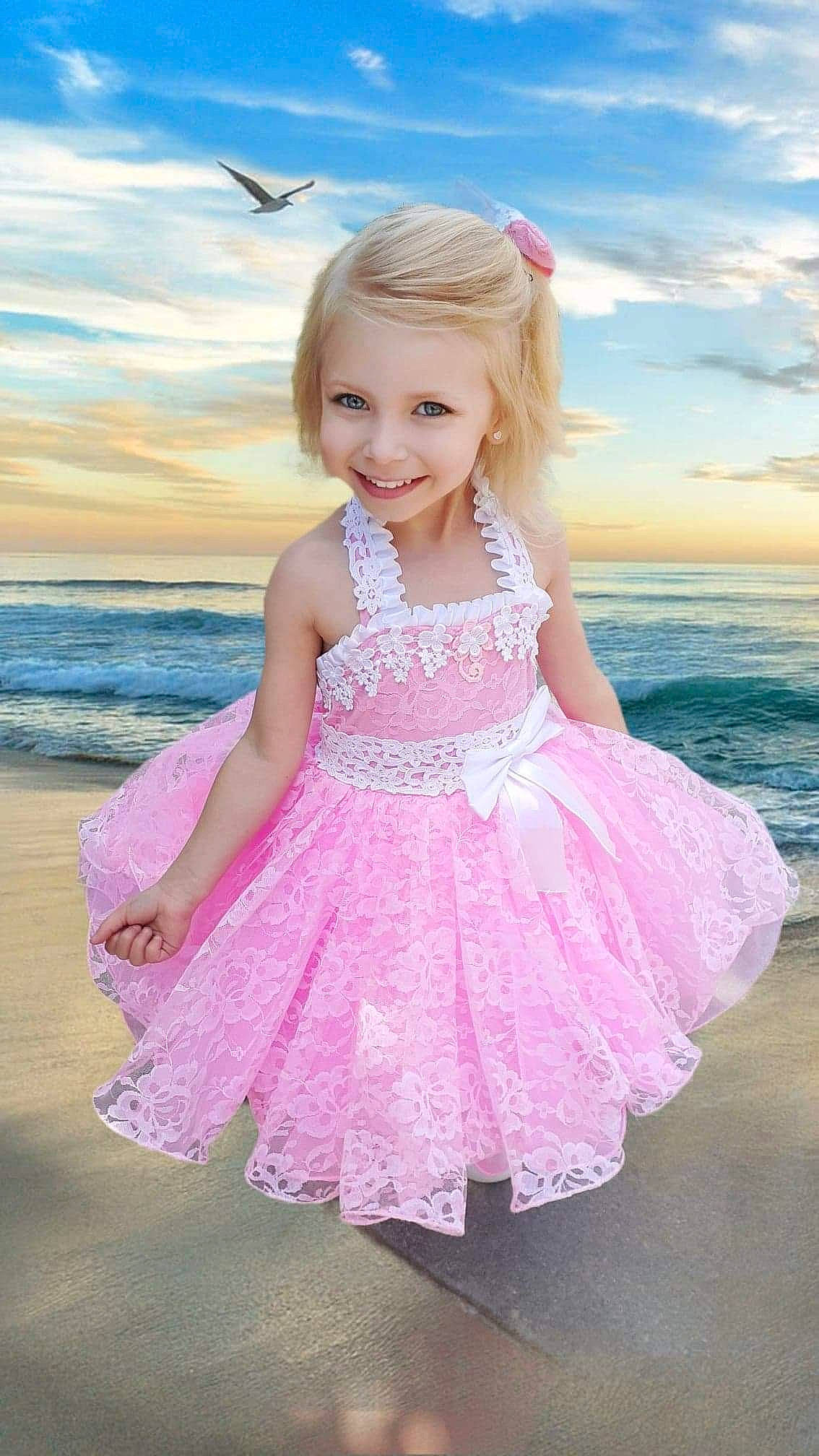 Kyliegh is registered to the contest to win money with this photo: baby_toddler_clothing, beach, beauty, bird, child, cloud, day_dress, dress, face, flash_photography, fun, happy, joy, magenta, person, pink, sky, smile, summer, toddler