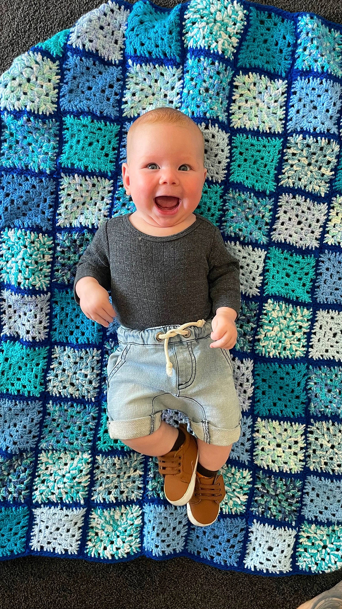Jax is registered to the contest to win money with this photo: aqua, azure, baby, baby_toddler_clothing, blue, dress, electric_blue, eye, face, happy, pattern, person, product, purple, shorts, skin, sleeve, smile, t_shirt, textile
