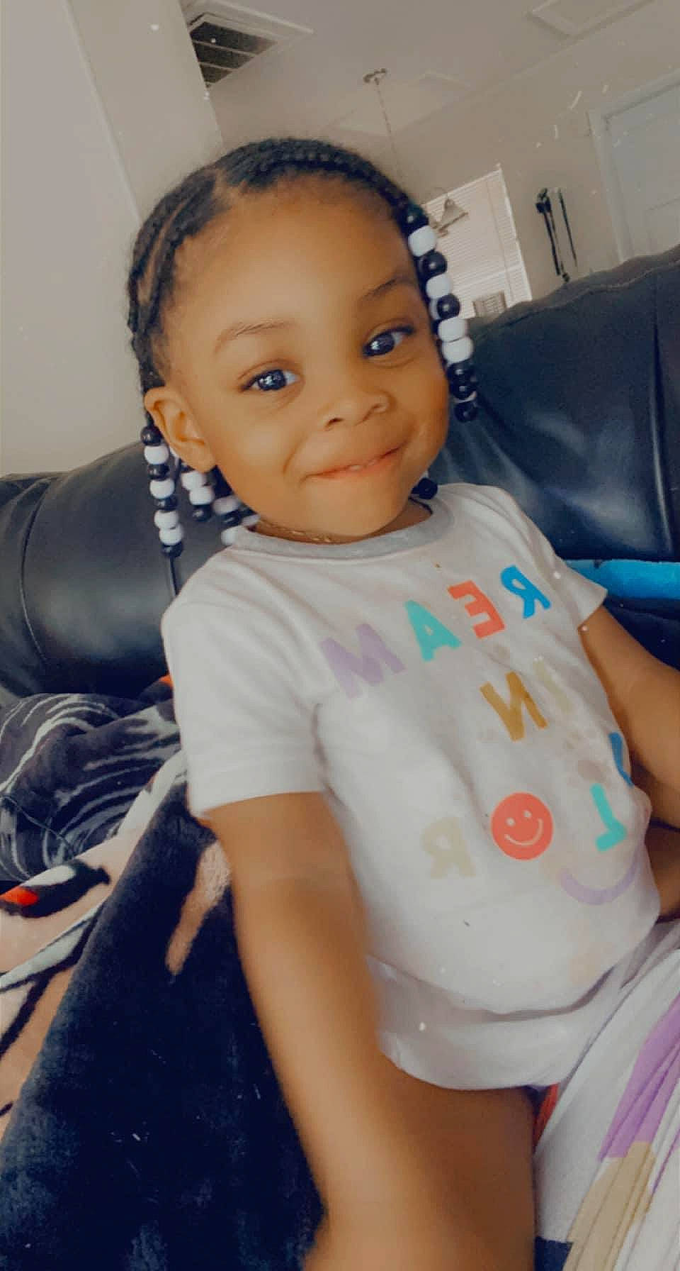 Jaelynn is registered to the contest to win money with this photo: arm, baby_toddler_clothing, cheek, chin, eye, eyebrow, face, facial_expression, forehead, hair, head, iris, joint, joy, lip, mouth, neck, nose, person, shoulder