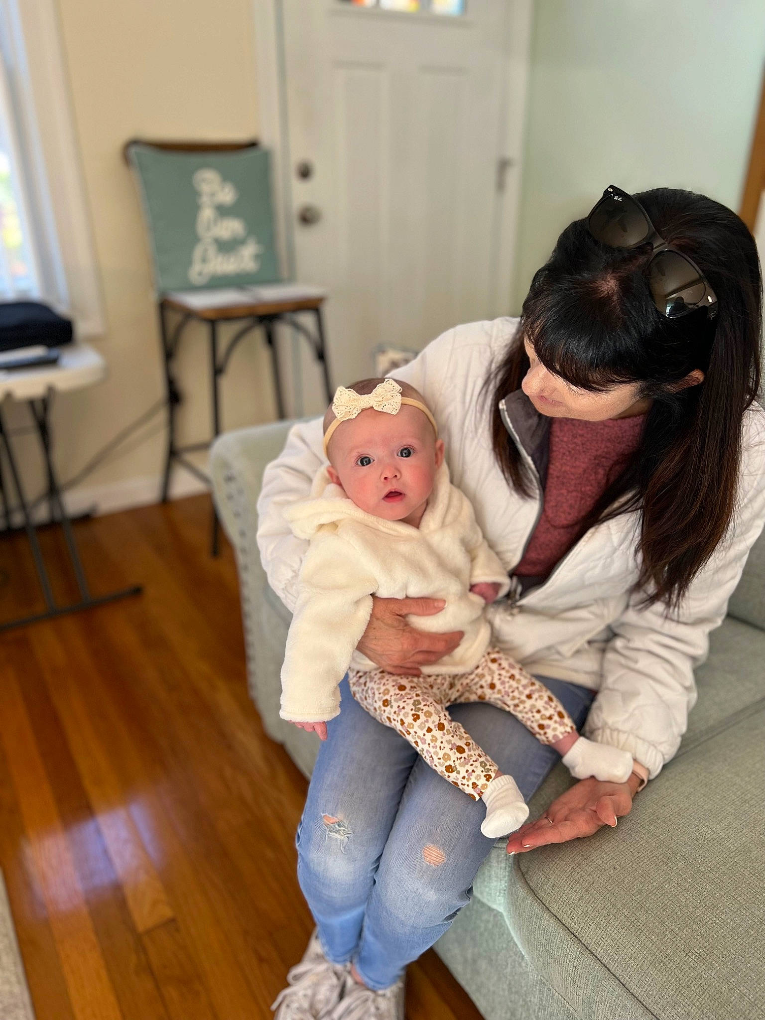 Madelyn joined the competition — help win amazing prizes! baby, baby_toddler_clothing, chair, child, comfort, costume, event, flooring, foot, fun, fur, happy, hardwood, hat, lap, person, picture_frame, sitting, surprise, toddler