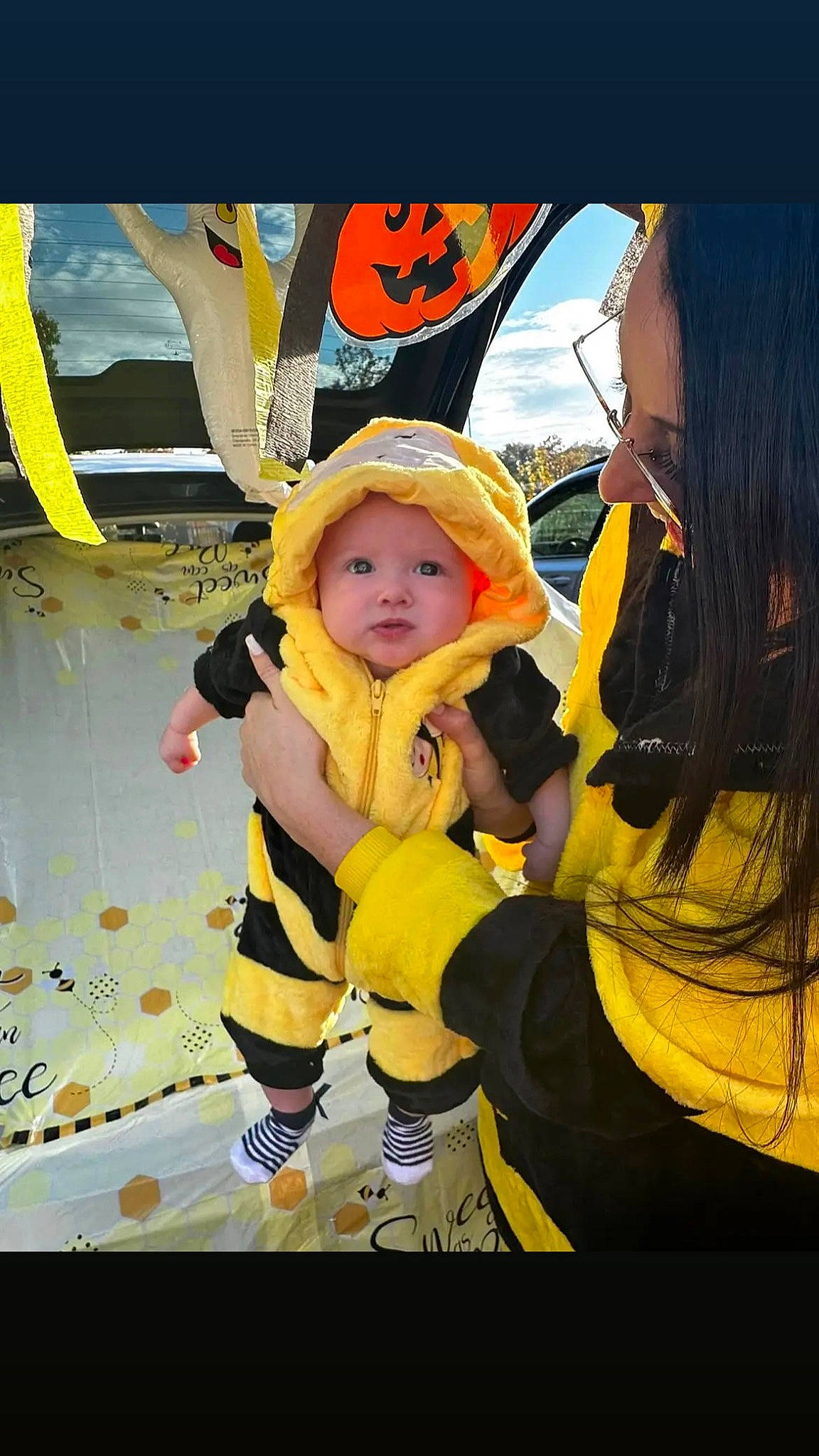 Madelyn is registered to the contest to win money with this photo: baby, baseball_cap, beanie, cap, child, costume, fun, happy, hat, headwear, leisure, pattern, person, personal_protective_equipment, plant, recreation, sun_hat, toddler, tree, yellow