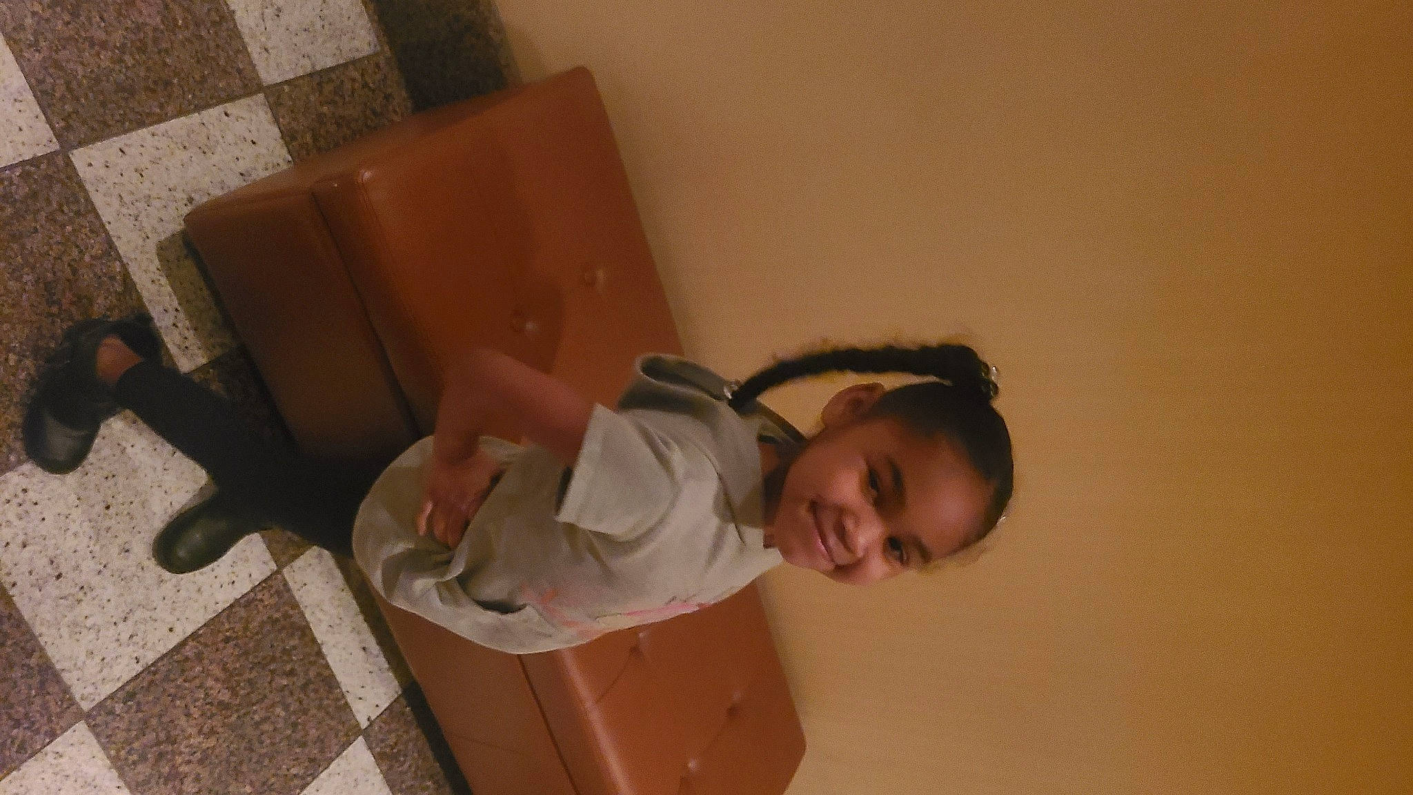 Christina is registered to the contest to win money with this photo: chair, child, comfort, elbow, eyewear, flooring, fun, hardwood, human_leg, joy, knee, neck, person, plaster, room, sitting, thigh, toddler, wood