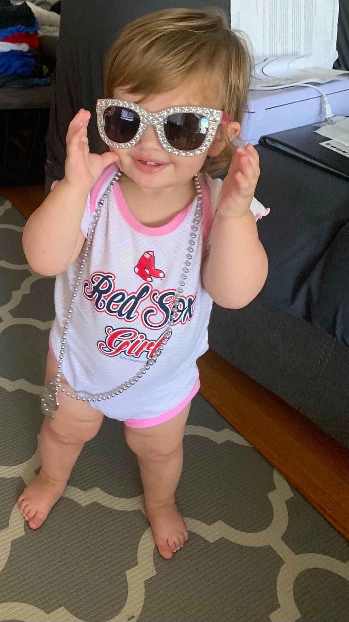Gianna is registered to the contest to win money with this photo: baby_toddler_clothing, eyewear, face, finger, glasses, goggles, hair, happy, head, joint, lip, mammal, mouth, person, pink, skin, sleeve, smile, sunglasses, vision_care