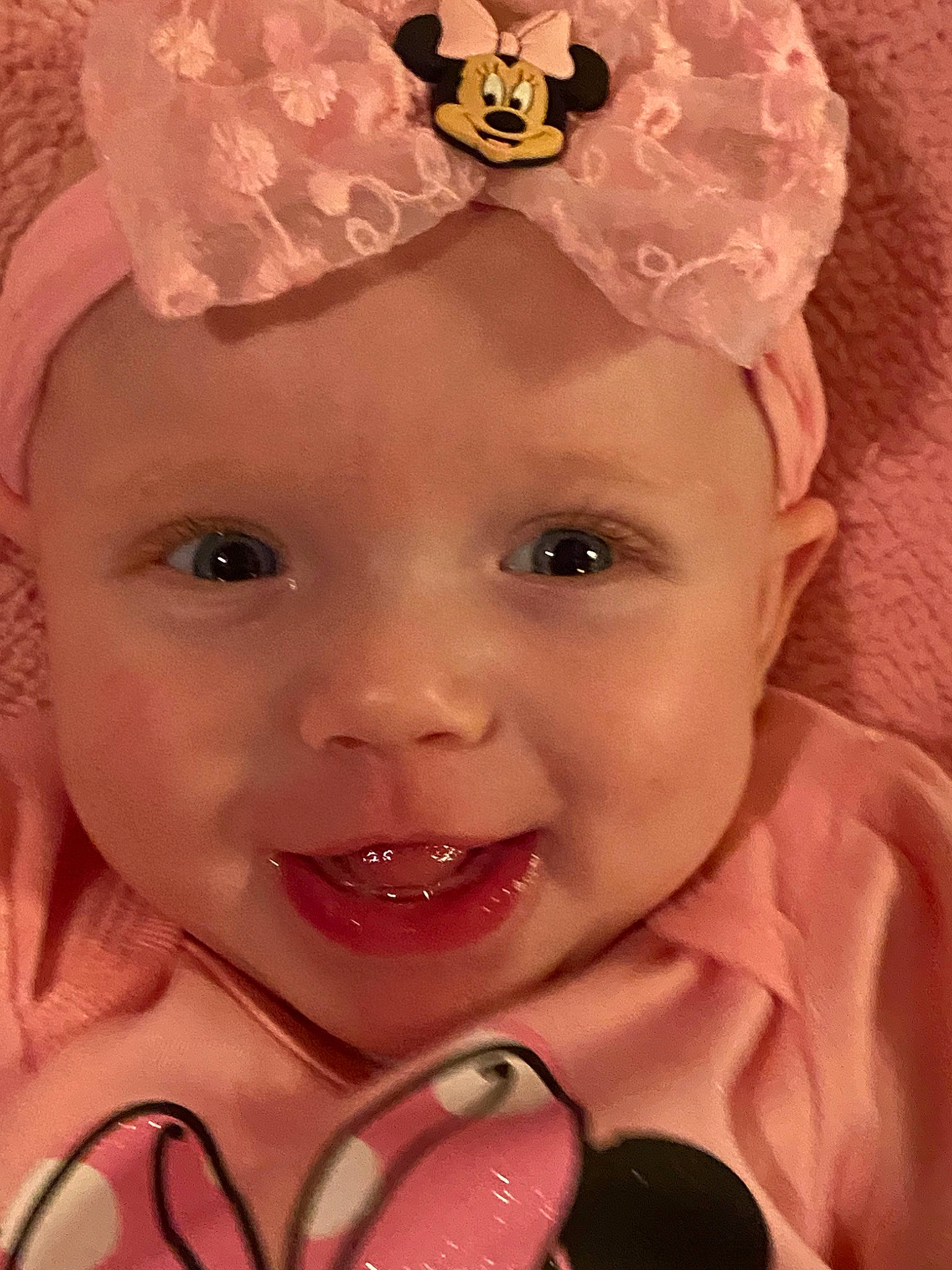 Kinsley is registered to the contest to win money with this photo: baby, cheek, child, close_up, eye, eyebrow, face, facial_expression, forehead, hair_accessory, head, headgear, headpiece, joy, lip, mouth, nose, person, pink, skin
