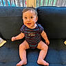 Daniel joined the competition — help win amazing prizes! baby, child, couch, eyes, face, furniture, hair, happy, indoors, infant, mouth, onesie, person, sitting, skin, smiling, sofa, striped_clothing, window, wooden_railing