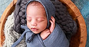 Caiden is registered to the contest to win money with this photo: baby, blue_bonnet, child, closeup, cozy, cute, headwear, indoors, infant, knitted_blanket, newborn, peaceful, portrait, resting, sleeping, soft_texture, swaddle, tiny_hand, wooden_bowl, wrapped