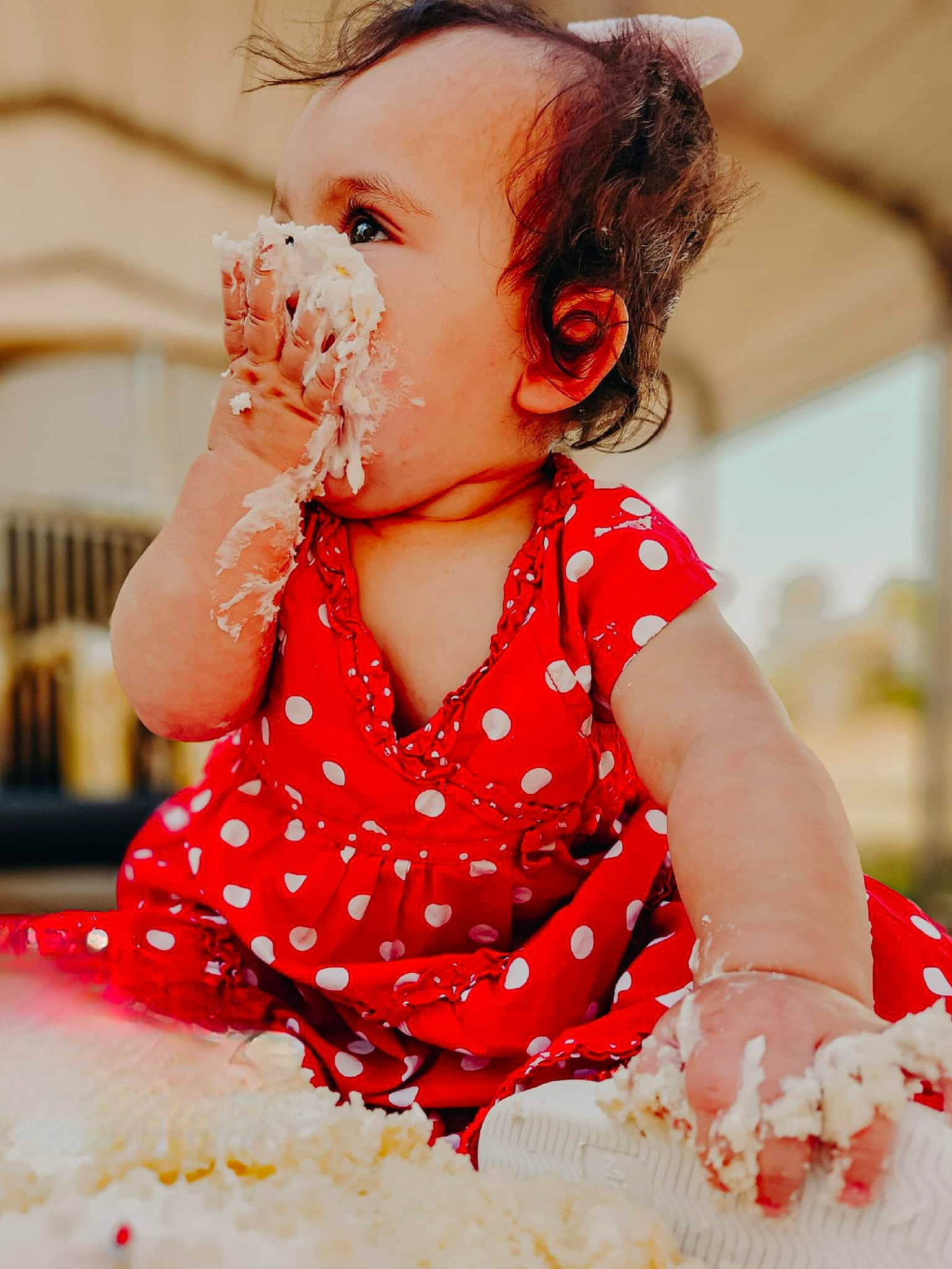 Nikita is registered to the contest to win money with this photo: arm, baby, baby_toddler_clothing, child, dress, eating, event, finger, food, fun, gesture, happy, nail, pattern, peach, person, pink, skin, sleeve, sweetness