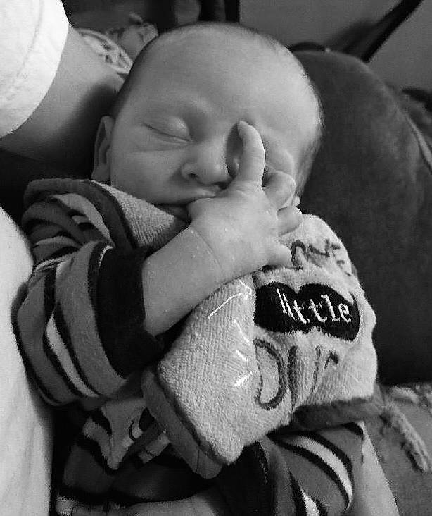 Canaan is registered to the contest to win money with this photo: baby, baby_products, baby_toddler_clothing, bedtime, black, cheek, child, comfort, finger, font, gesture, happy, monochrome, monochrome_photography, nail, nap, person, portrait_photography, sitting, thumb