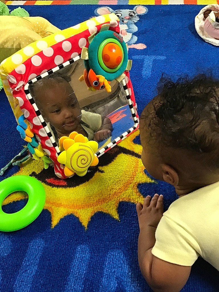 Irie is registered to the contest to win money with this photo: art, baby, baby_playing_with_toys, baby_products, baby_toddler_clothing, baby_toys, child, event, fun, happy, leisure, person, play, playmat, recreation, room, sharing, t_shirt, toddler, toy