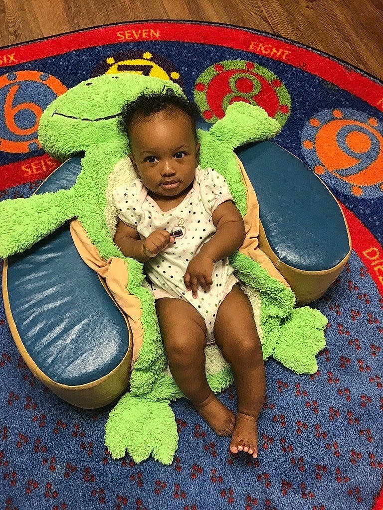 Irie joined the competition — help win amazing prizes! baby, baby_products, baby_toddler_clothing, child, circle, flooring, fun, grass, hairstyle, happy, lap, leisure, pattern, people_in_nature, person, play, sandal, sitting, textile, thigh