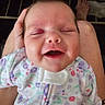 Elodie joined the competition — help win amazing prizes! baby, smiling, face, infant, onesie, patterned_clothing, happy, person, hand, lap, hair, skin, closeup, cute, child, newborn, relaxing, indoors, portrait, expression