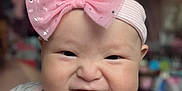 Valerian Jo joined the competition — help win amazing prizes! baby, child, face, headband, pink_bow, expression, indoor, blurred_background, clothing, cute, infant, smile, scrunched_face, chubby_cheeks, person, portrait, young_child, apparel, headwear, happy