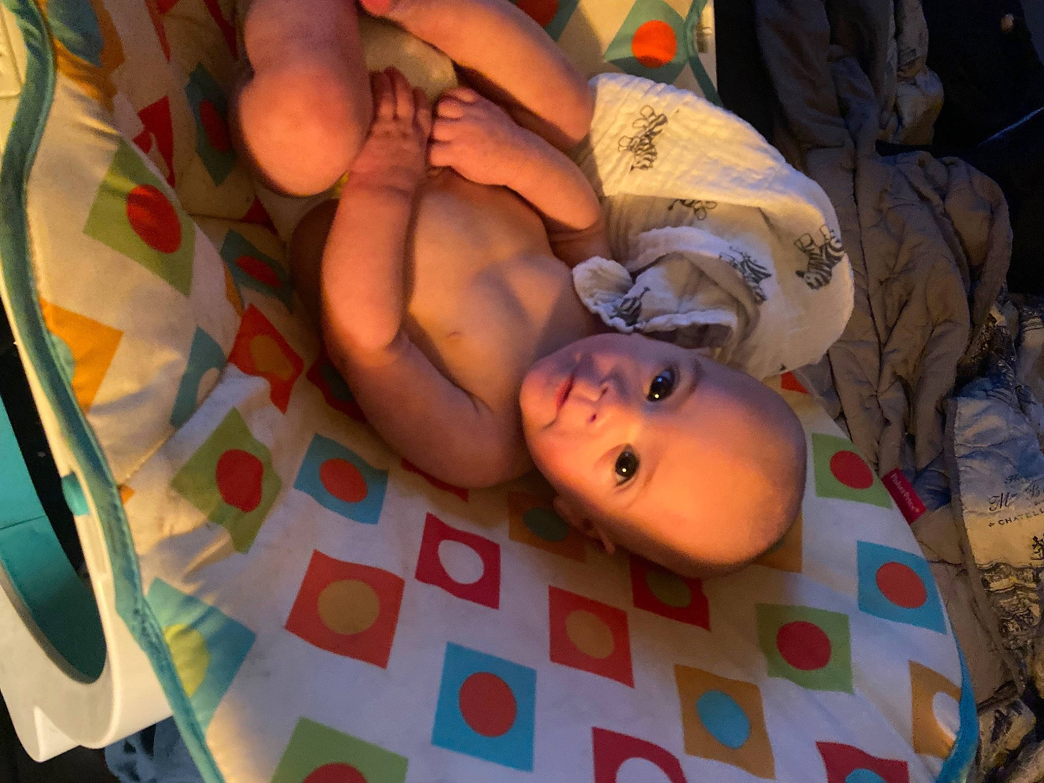 Fred is registered to the contest to win money with this photo: abdomen, art, barechested, chest, child, flesh, foot, fun, human_leg, mouth, nail, navel, pattern, person, room, textile, thigh, toy, trunk, visual_arts