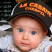 Eulalia participe au concours pour gagner de l'argent avec cette photo : baby, blue_eyes, cap, hat, face, infant, child, cute, chubby_cheeks, clothing, indoor, person, portrait, closeup, expression, sitting, looking, young_child, headwear, apparel