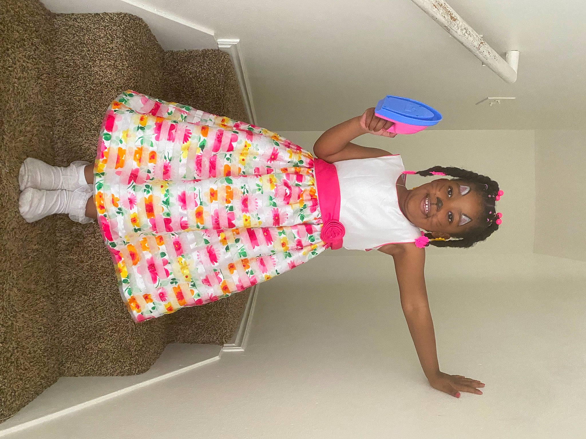 Gianna is registered to the contest to win money with this photo: baby_toddler_clothing, child, comfort, elbow, floor, flooring, foot, fun, human_leg, joint, joy, knee, leg, magenta, pattern, person, pink, sandal, sleeve, thigh