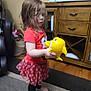 Emalee joined the competition — help win amazing prizes! barefoot, black_leggings, cabinet, carpet, child, curly_hair, cute, fish_toy, floor, girl, home, indoor, person, play, polka_dot_skirt, red_shirt, toy, wooden_furniture, yellow_toy, young_child