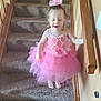 Emalee joined the competition — help win amazing prizes! barefoot, carpeted_stairs, child, cute, fun, girl, hair_bow, happy, holding_railing, home_interior, indoor, person, pink_dress, playful, small_child, smiling, staircase, tulle_skirt, wooden_railing, young_child