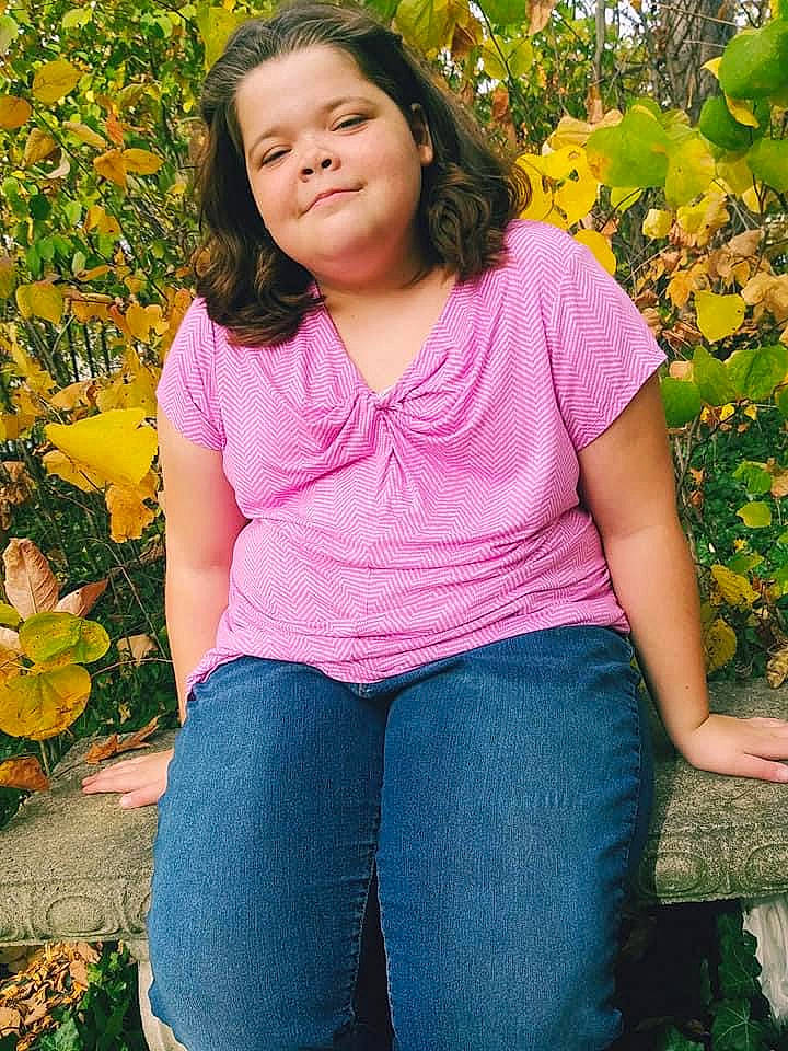 Hannah joined the competition — help win amazing prizes! abdomen, beauty, botany, child, child_model, clothing, denim, grass, jeans, joy, leaf, people, person, photography, pink, purple, sitting, smile, textile, toddler