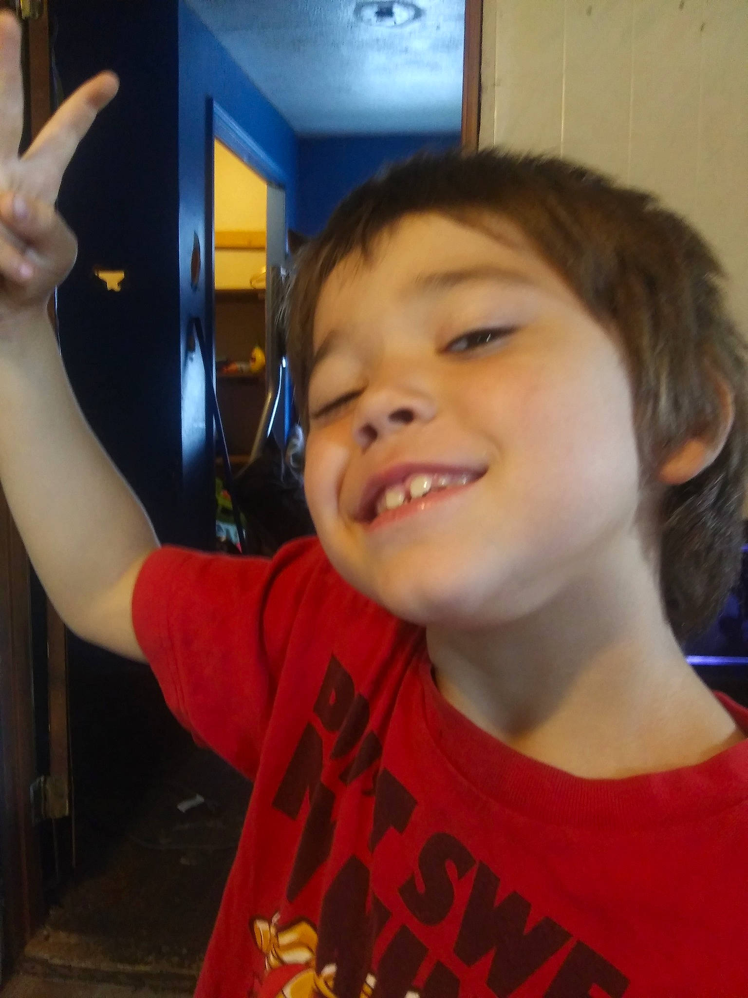 Dean is registered to the contest to win money with this photo: cheek, child, chin, cool, ear, eyebrow, face, finger, forehead, fun, gesture, hair, jaw, joy, long_hair, mouth, nose, organ, person, smile