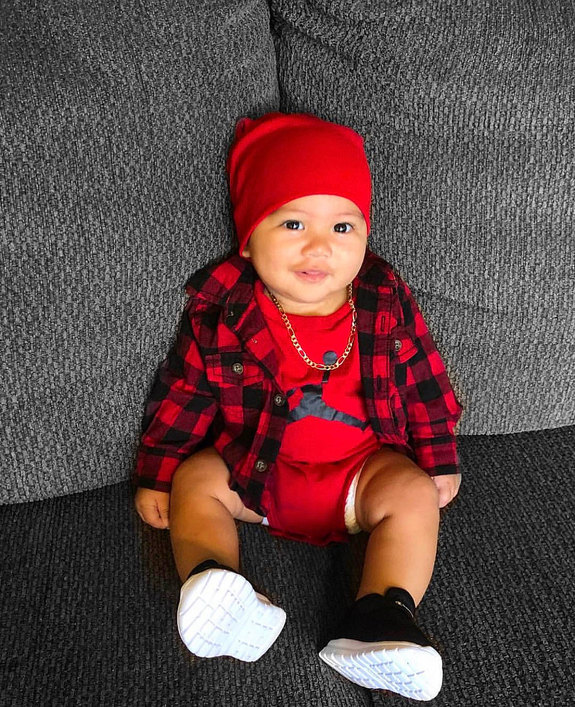 Aaezial is registered to the contest to win money with this photo: baby, beanie, cap, child, child_model, flooring, headgear, knit_cap, pattern, person, photography, play, red, shoe, sitting, smile, toddler