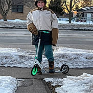 Adian joined the competition — help win amazing prizes! child, kid, scooter, winter, snow, sidewalk, coat, jacket, hat, boots, smile, outdoor, sunset, trees, house, playground, pavement, street, portrait, recreation