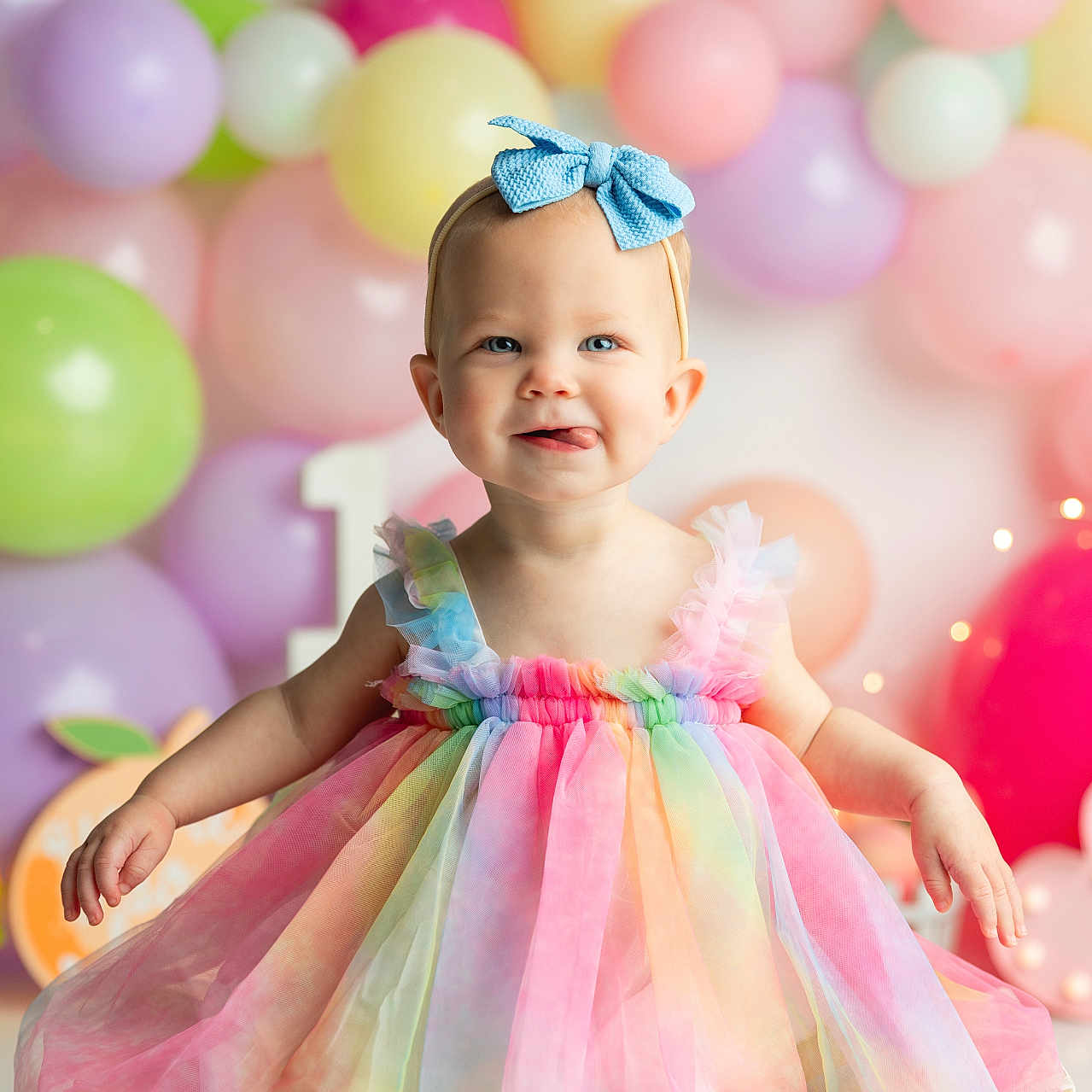 Lynnon is registered to the contest to win money with this photo: baby, balloon, bodypart, clothing, dress, face, formalwear, fun, happy, hat, head, medication, party, people, person, photography, pill, portrait, smile, sphere