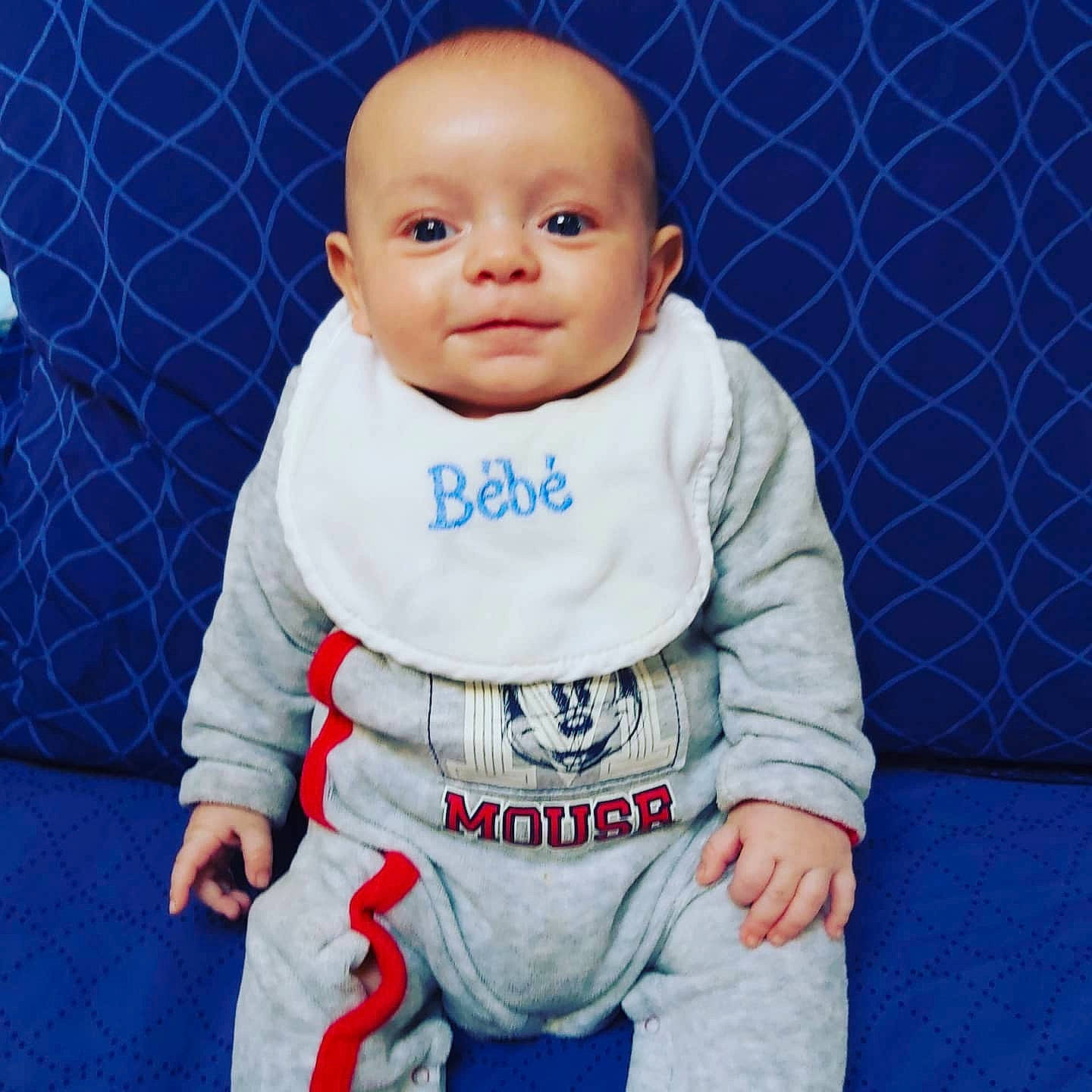 Dylan participe au concours pour gagner de l'argent avec cette photo : baby, baby_products, baby_toddler_clothing, baby_toys, blue, cheek, child, contact_sport, doll, forehead, japanese_martial_arts, karate, martial_arts_uniform, pajamas, person, sitting, sleeve, space, toy