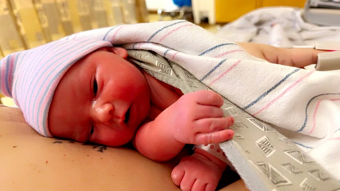 Landen is registered to the contest to win money with this photo: baby, baby_sleeping, baby_toddler_clothing, bedtime, child, comfort, computer_keyboard, finger, flesh, foot, gesture, headwear, human_leg, linens, nail, person, room, skin, thumb, toddler