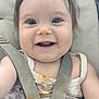 baby, child, smiling, face, blue_eyes, car_seat, seatbelt, clothing, tank_top, messy, food_stains, happy, infant, cute, person, closeup, indoors, skin, hair, expression
