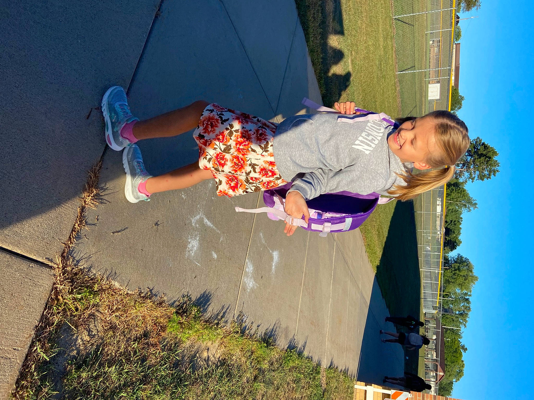 Evalynn is registered to the contest to win money with this photo: barefoot, child, electric_blue, fun, grass, happy, human_leg, joy, leisure, people_in_nature, person, play, recreation, shadow, sky, tints_and_shades, toddler, tree, vacation, water