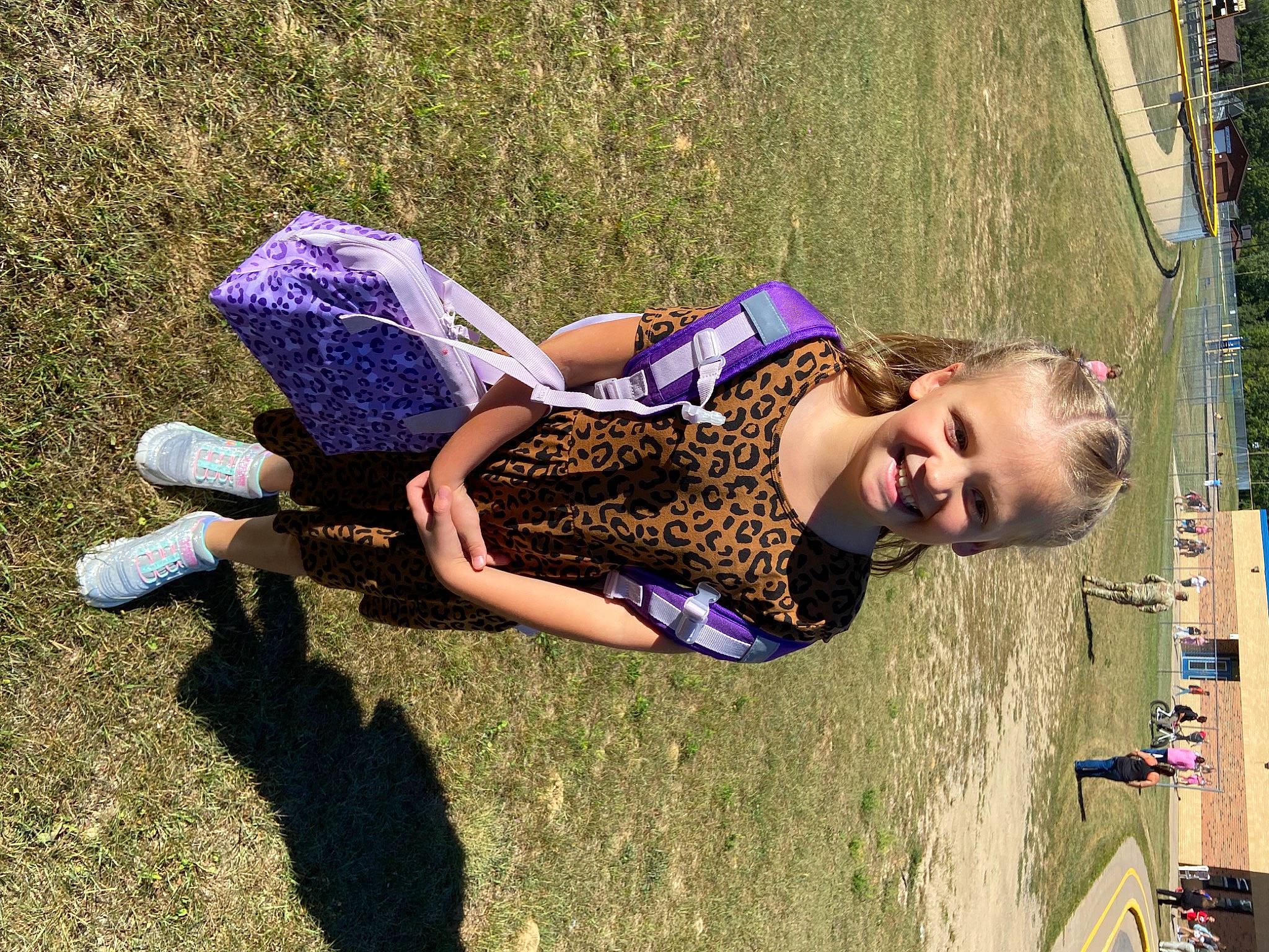 Evalynn is registered to the contest to win money with this photo: child, city, electric_blue, fun, grass, happy, human_leg, joy, leisure, outdoor_play_equipment, people_in_nature, person, plant, play, recreation, shadow, smile, soil, swing, toddler