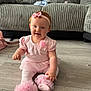 baby, girl, pink_clothing, headband, smile, sitting, floor, couch, indoor, child, tulle, sock, cute, happy, infant, person, toddler, home, decor, portrait