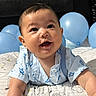 Chadric Ashton is registered to the contest to win money with this photo: baby, child, infant, smiling, happy, portrait, indoors, bed, balloons, blue_balloons, pajamas, patterned_clothing, sitting, crawling, face, eyes, mouth, bedroom, closeup, photography