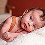 baby, infant, newborn, portrait, face, eyes, blanket, soft_texture, lying_down, cozy, skin, gaze, expression, hair, arm, indoors, closeup, resting, cute, nursery