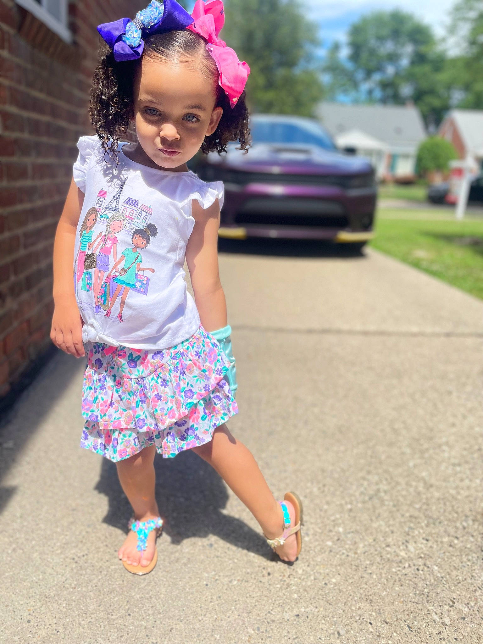 Carlie is registered to the contest to win money with this photo: asphalt, car, child, electric_blue, eye, fun, grass, happy, headpiece, jewellery, leisure, magenta, pattern, person, pink, recreation, road, sandal, summer, toddler