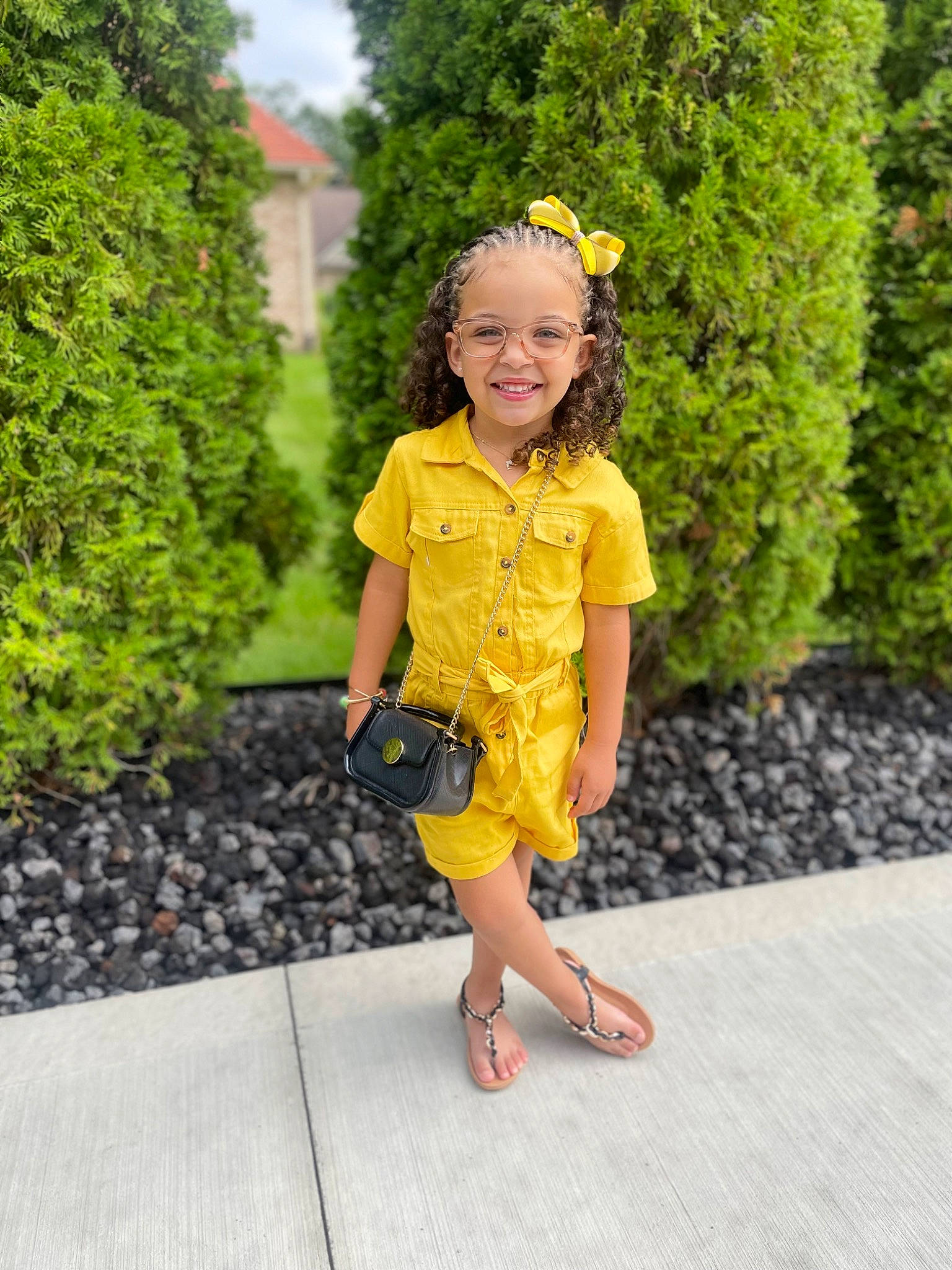 Carlie is registered to the contest to win money with this photo: baby_toddler_clothing, blond, botany, day_dress, electric_blue, flower, fun, grass, happy, human_leg, joy, leisure, magenta, people_in_nature, person, plant, sandal, sleeve, smile, thigh