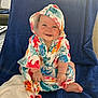 Daisy joined the competition — help win amazing prizes! baby, barefoot, blue_blanket, child, clothing, colorful, cozy, cute, face, happy, hooded_towel, indoor, infant, playful, portrait, sea_creatures, sitting, smiling, soft_light, warm