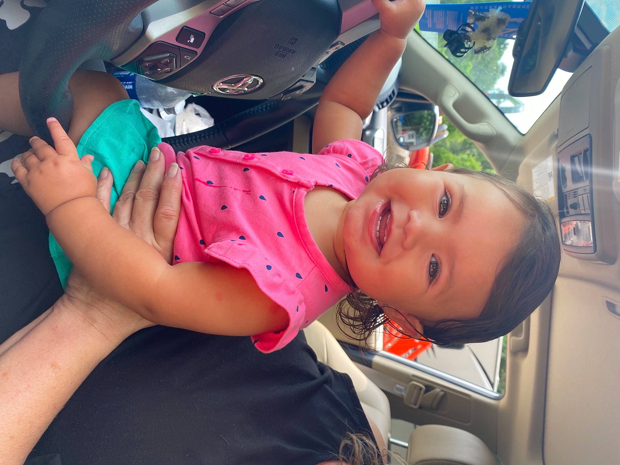 Willow is registered to the contest to win money with this photo: auto_part, automotive_design, automotive_exterior, automotive_lighting, car, car_seat, child, eyewear, fun, happy, hat, human_leg, joy, leisure, motor_vehicle, mouth, person, skin, sunglasses, thigh