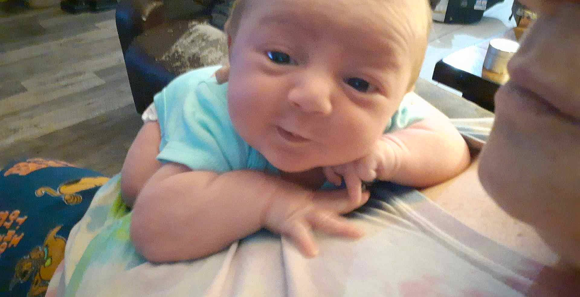 Ruby is registered to the contest to win money with this photo: baby, baby_toddler_clothing, cheek, eye, eyelash, flooring, fun, gesture, grass, hairstyle, happy, head, iris, mouth, nail, nose, person, skin, smile, thumb